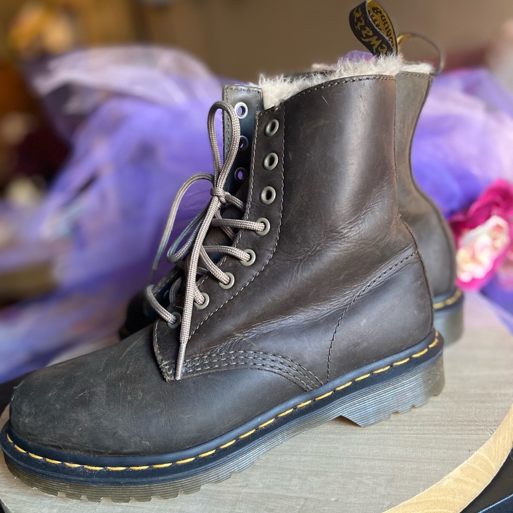 Dr. Martens laced boots in military green.